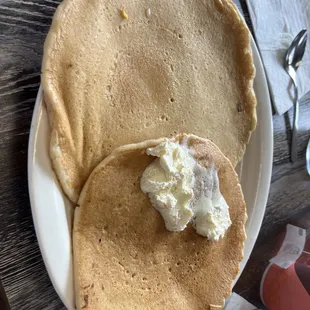 a plate of pancakes with butter