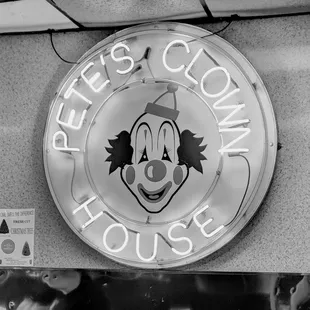 a neon sign for pete&apos;s clown house
