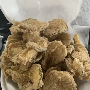 fried oysters in a styrofoam container