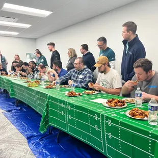 a large group of people eating