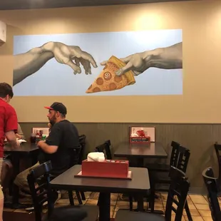 two men eating pizza