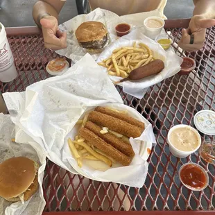 double moster burger messy with jalapeños, crabettes and chips, fish sandwich messy with cheese and of course extra awesome sauce.