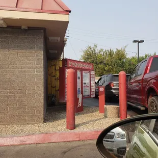 a red truck parked in front of a restaurant