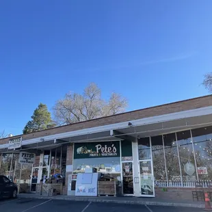 Storefront and sign + Next to liquor store