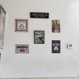 a wall with a variety of signs on it