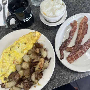 Side of bacon, grits, and home fries and a veggie omelet