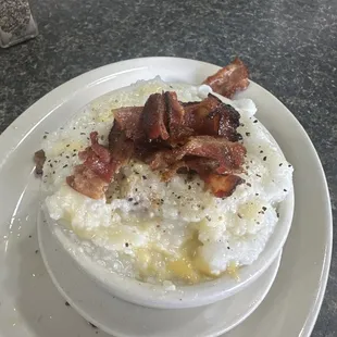 Grits with cheese and bacon crumbled on top