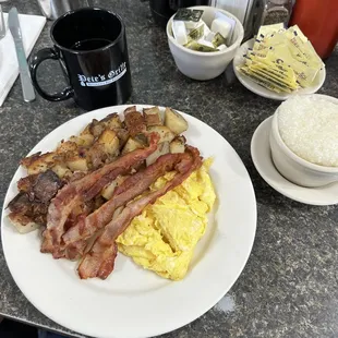 one egg platter with bacon and home fries and a side of grits