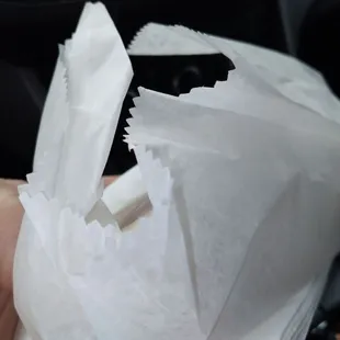 a hand holding a piece of paper