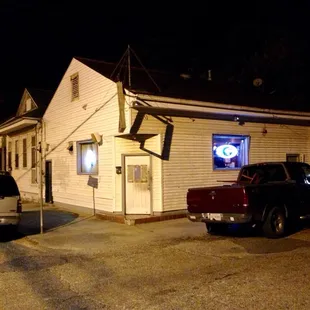 two cars parked in front of the building