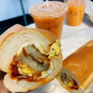 Bacon egg cheese with hash brown on a hoagie roll with saltpeppaketchup / Thai tea (food insta: @aje.eats)