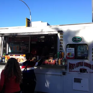 people ordering food from a food truck