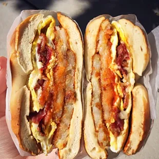 Bacon, egg, cheese, and hash browns on a bagel with saltpeppaketchup. OH YESSS.