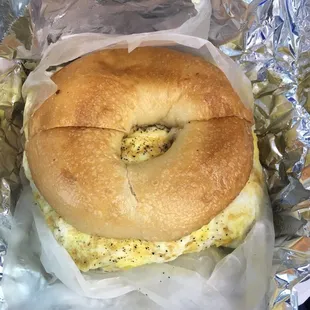 a bagel sandwich wrapped in foil