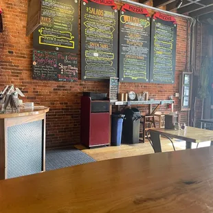 Chalk board menus on the right side of the wall once you walk in