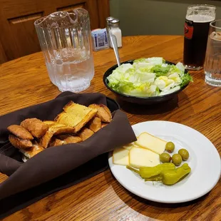 a plate of food and a glass of beer