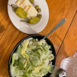 a bowl of lettuce and cheese