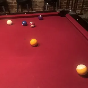 a pool table with balls on it