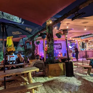 tables and umbrellas at night