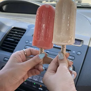 a person holding a popsicle