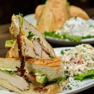 two plates of sandwiches