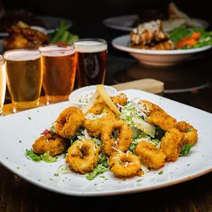 a plate of fried shrimp and salad