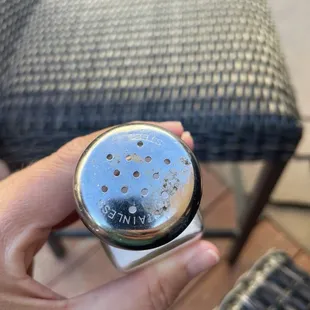 Gross, wipe your salt shakers! If you have time to sit around chatting with other workers you have time to clean!!