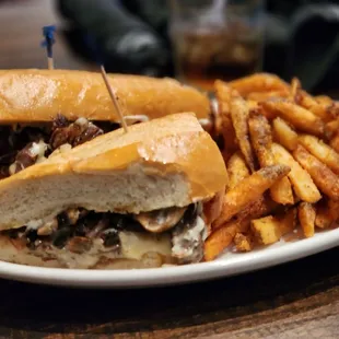 Cheese steak sandwich with fries