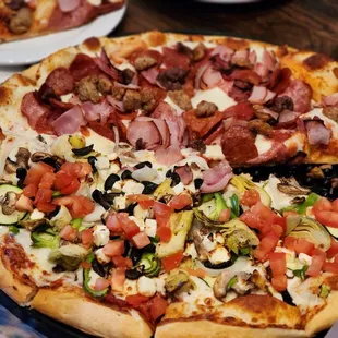 Half vegetarian and meat pizza