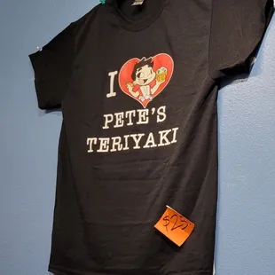 a t - shirt hanging on a wall