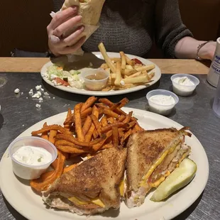 Tuna Melt with Sweet Potato Fries. Vegetable Pita Pocket with fries.