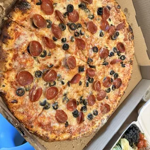 Large pizza with pep and black olives