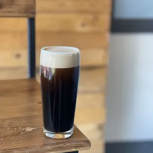 a glass of beer on a table
