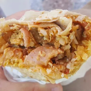 Breakfast burrito. Tasty, but tiny.  Guess it&apos;s fitting at a place called Petit Café. Get two! :)