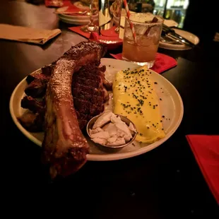 Tomahawk with a French omelet and anchovy butter