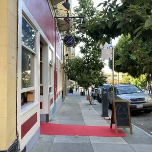 a red carpet on the sidewalk