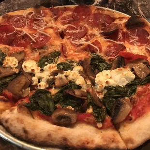 Half pepperoni and half mushroom, spinach goat cheese. Yumm!