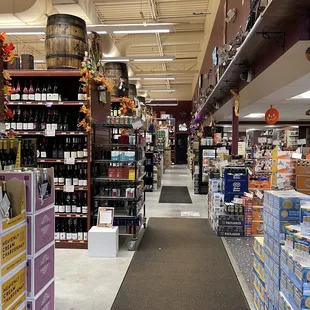 a wide aisle of wine bottles