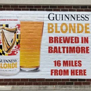 Guinness wants us to know it is locally brewed even going so far as to painting on the wall at Petite Cellars