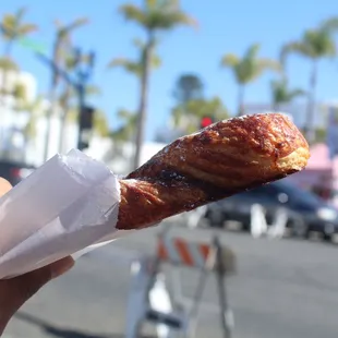 a person holding a pastry