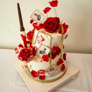 a cake with roses and a knife