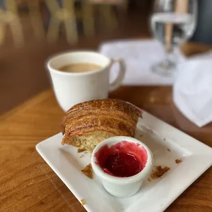 Best homemade jam ever and a half eaten croissant (couldn&apos;t wait to take a bite)
