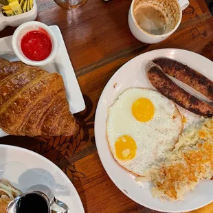 Hashbrown and chicken sausage with sunny side up eggs And Add Extra Croissant &amp; Jam