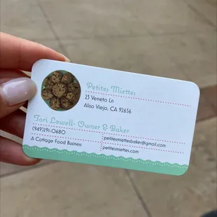 a person holding a business card