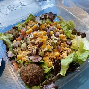 a salad in a plastic container