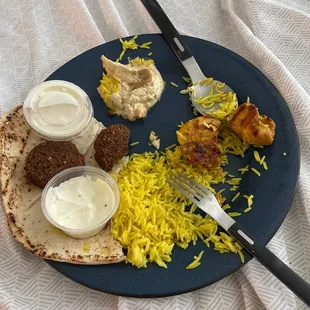 a plate of food on a bed