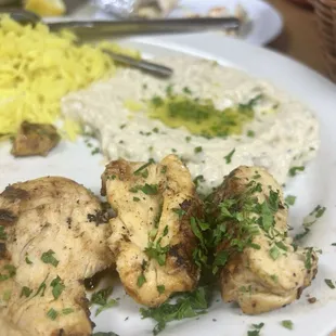 a plate of chicken and rice