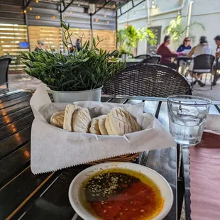 Complimentary pita and spicy olive oil