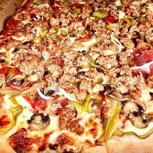 Large specialty pizza. Fully loaded, toppings maxed out.