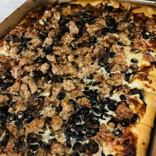 Yummy pizza. Black olives, sausage and mushrooms.